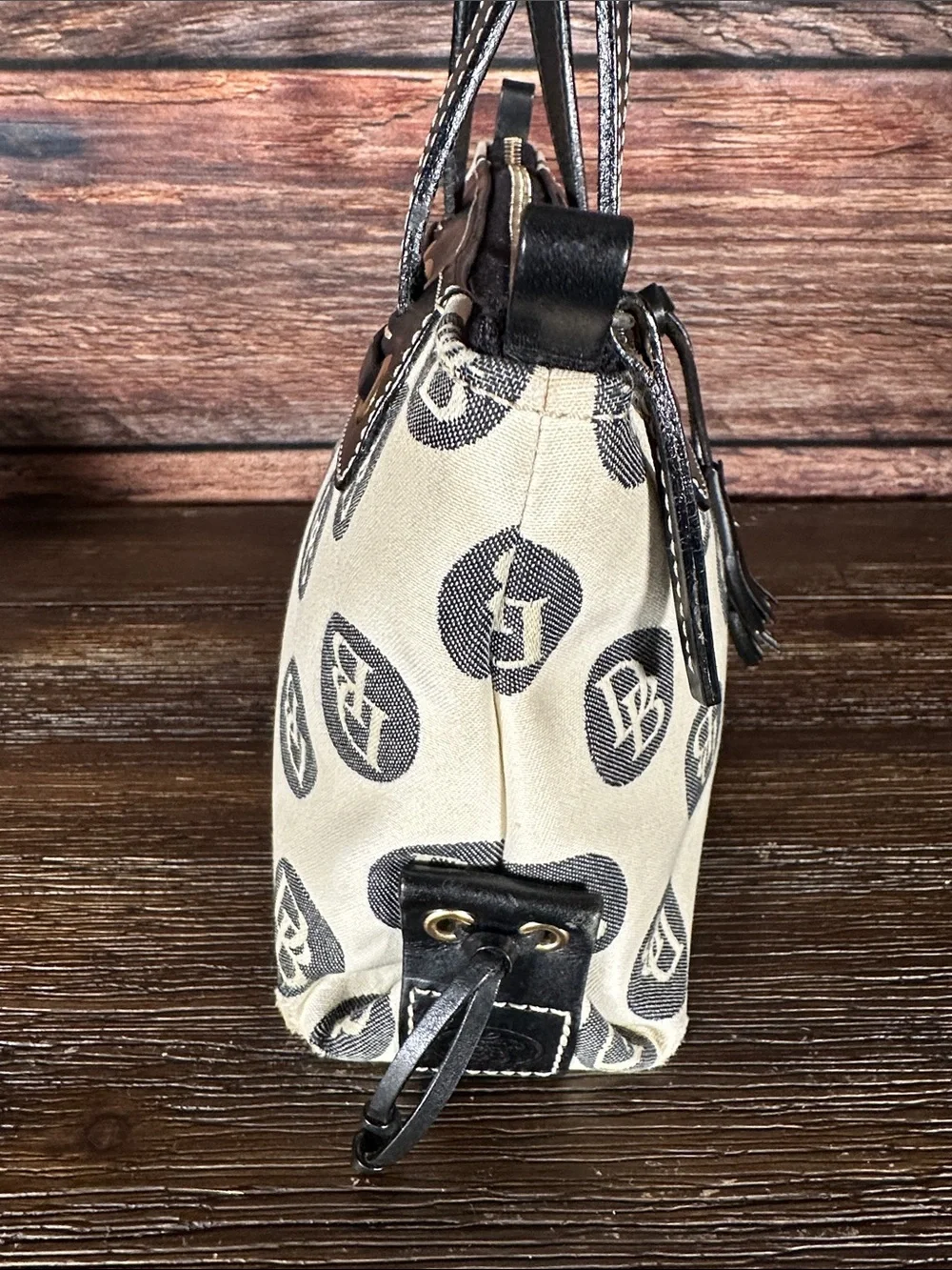 Dooney & Bourke Vintage logo jacquard handbag in cream and black.
